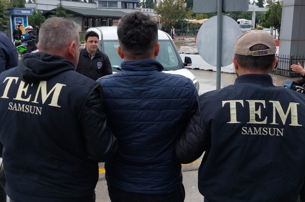 Police escort a FETÖ suspect in the northern city of Samsun, Türkiye, Oct. 18, 2022. (IHA Photo)