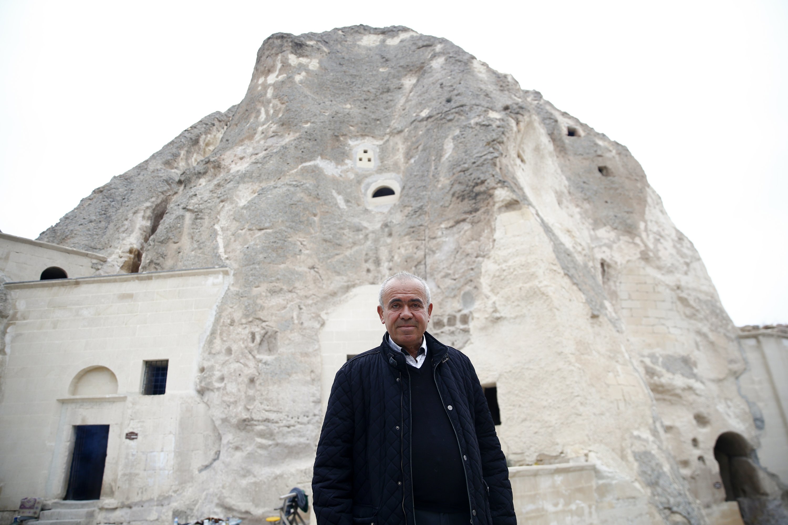 Cabir Coşkuner poses outside the monastery, in Nevşehir, central Türkiye, Nov. 28, 2022. (AA Photo)