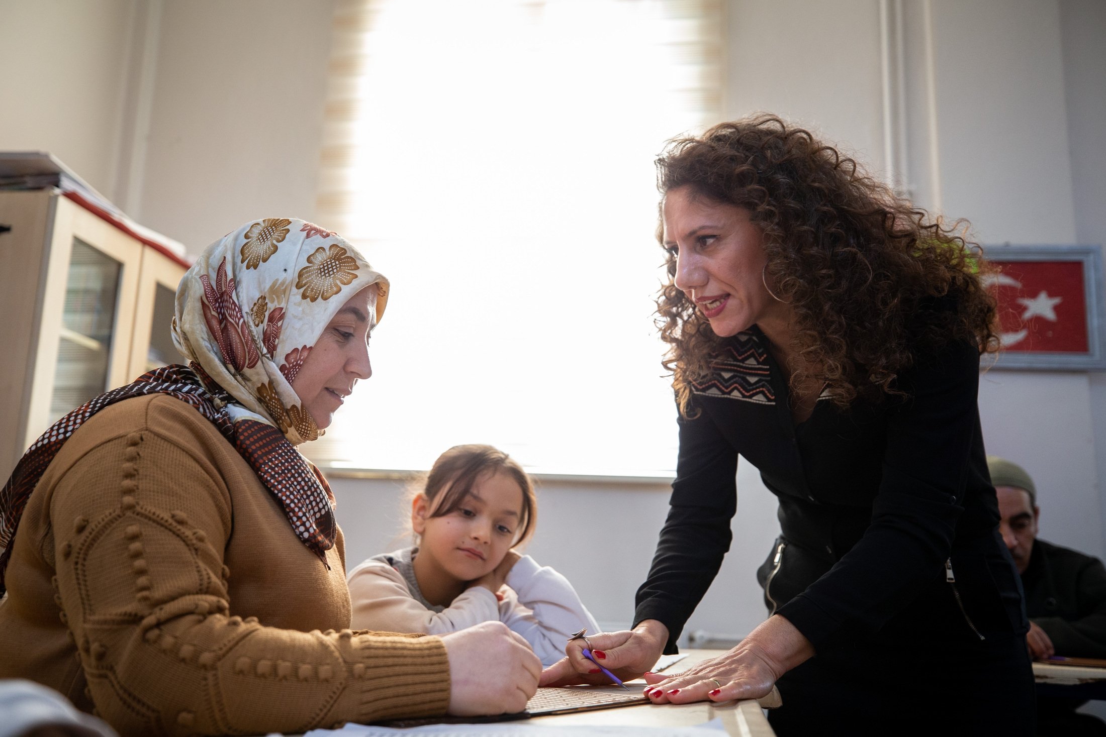 250185 A special education teacher provides the mother of a student with information on the Braille alphabet, Ankara, Türkiye, Jan. 4, 2022. (AA Photo)